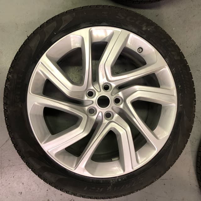 Refinished silver alloy wheel mounted on a Pirelli Scorpion tire