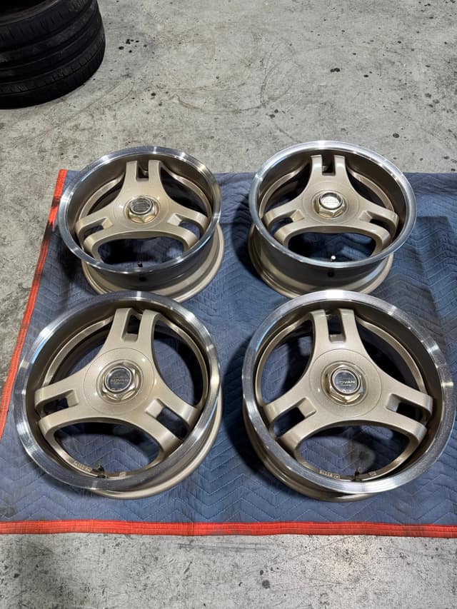 Set of four three-spoke wheels refinished in bronze