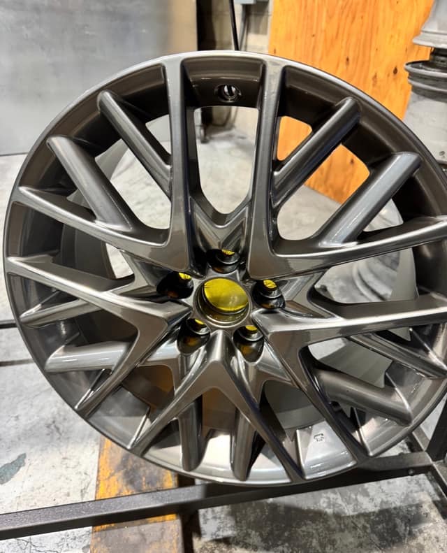 Multi-spoke wheel refinished in gunmetal grey