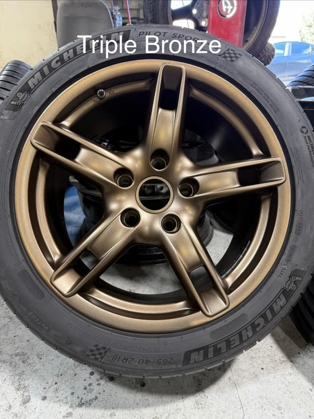 Wheel powder coated in Triple Bronze, mounted on a Pirelli tire